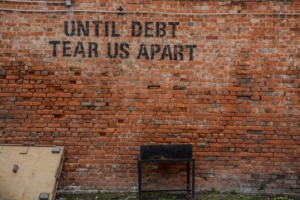 until debt tear us apart - Stark-Macher